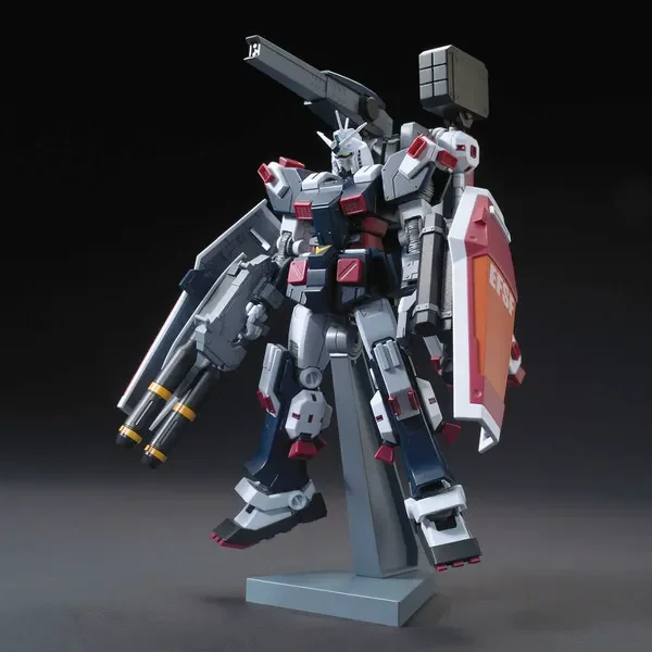 HG 1/144 フルアーマー・ガンダム（GUNDAM THUNDERBOLT Ver.）の公式の商品写真。灰色と白の重武装の機体が台座に立っている